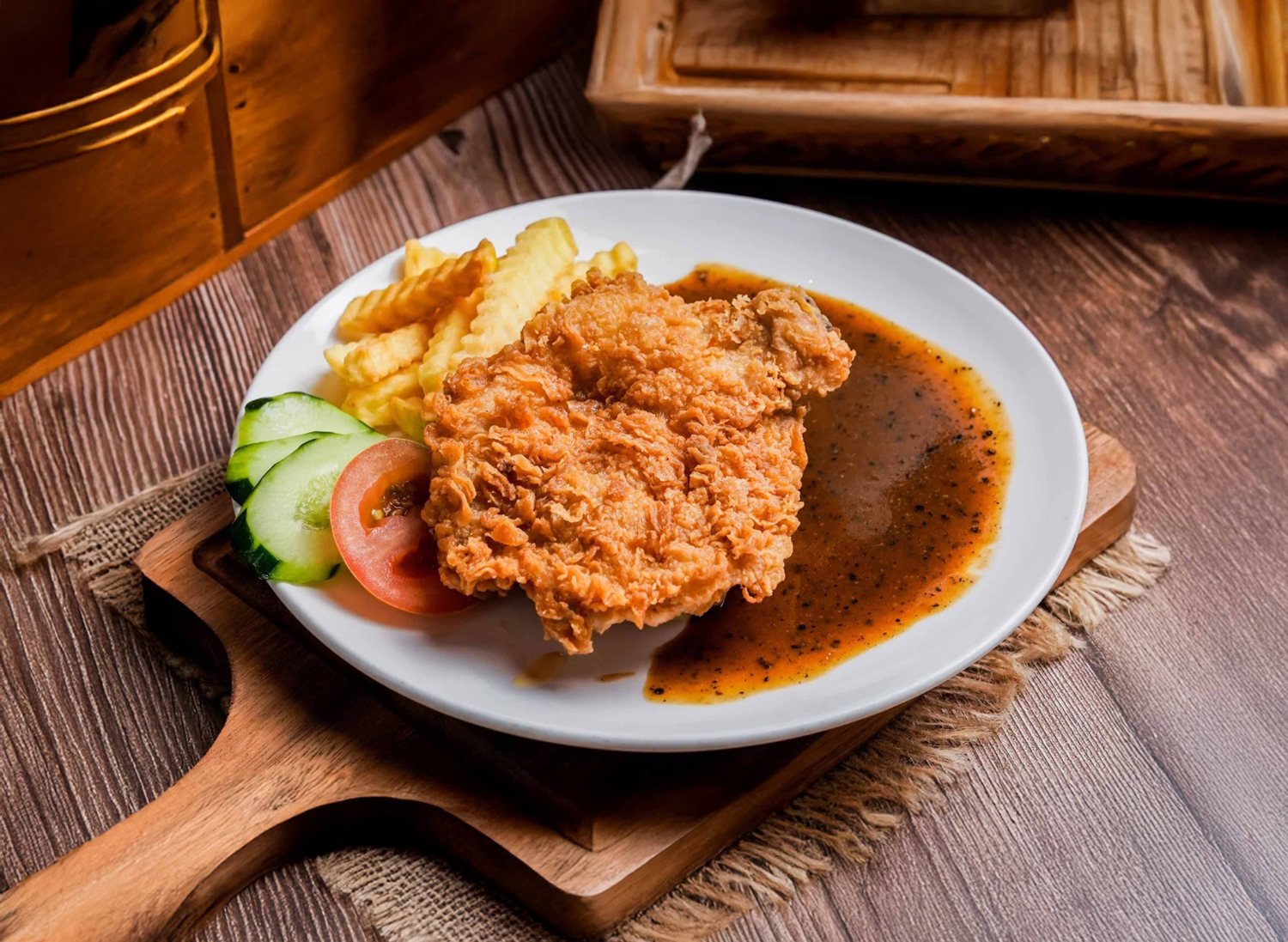 Chicken chop with fries and sauce at The Savore Station
